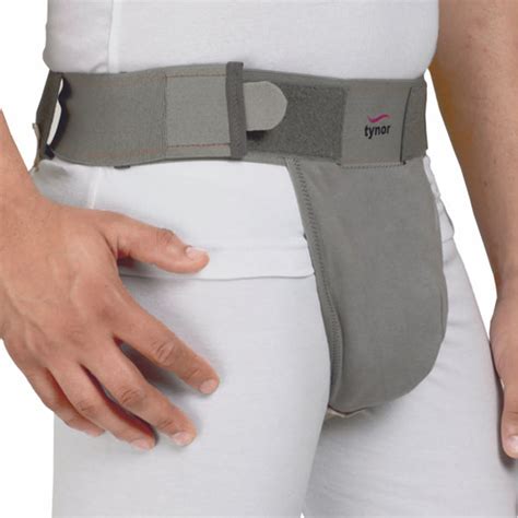 Infografía comparando la zona escrotal sin soporte y con la faja de soporte, destacando la reducción de movimiento